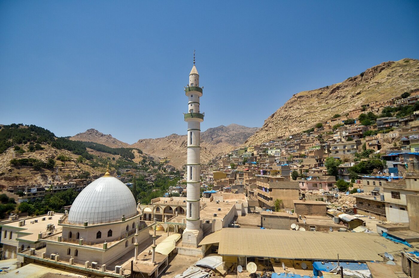 The mountain town of Akre with stone houses on a hillside in the Kurdistan Region of Iraq