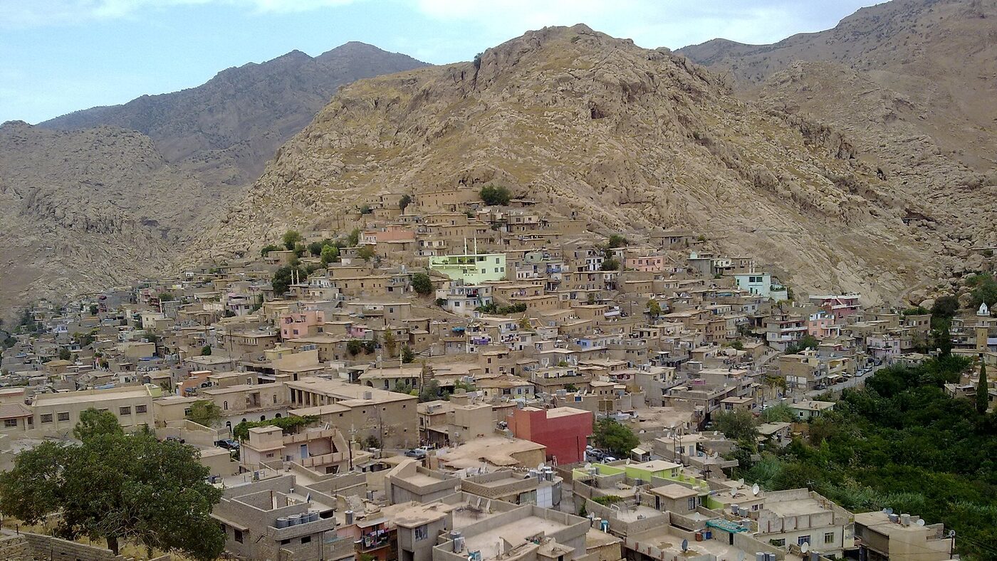 Historic Akre during sunset with houses climbing the hillside
