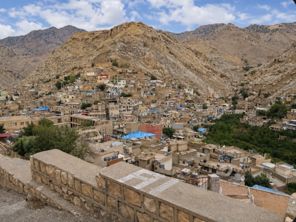 The mountain town of Akre with stone houses on a hillside in the Kurdistan Region of Iraq